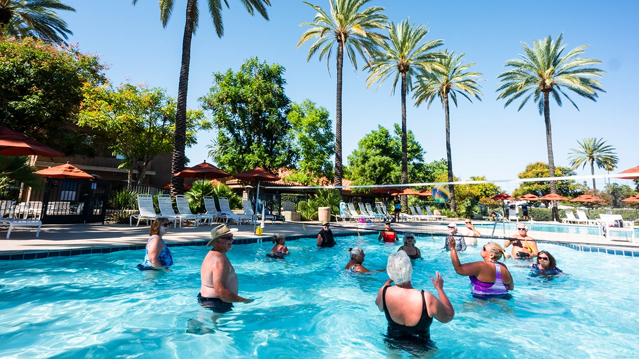Pool activities at Golden Village Palms RV Resort